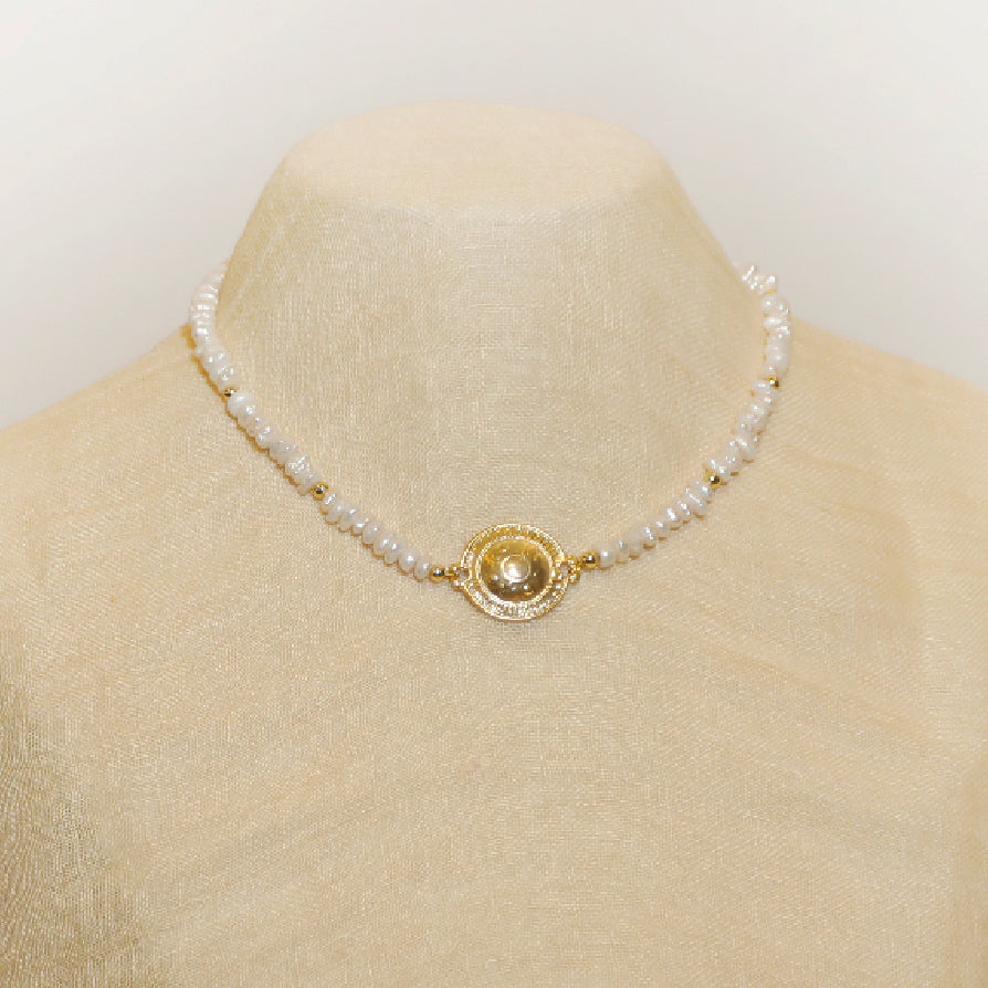 A stylish pearls necklace with a gold pendant makes perfect gift for fiance